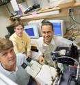 Wake Forest University physics professors (from left to right) Martin Guthold, Keith Bonin and Jed Macasko work in Guthold's laboratory on development of Lab-on-Bead processing, a novel drug-screening technique with the potential to be 10,000 times faster than current methods.