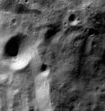 Picture of the lunar polar region taken by Chandrayaan-1's Terrain Mapping Camera (TMC) on 15 November 2008. Taken over the polar region of the moon, the picture shows many large and small craters. To the lower left, is the brightly-lit rim of 117 km-wide Moretus crater.