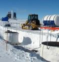 The IceTop surface array of detectors is installed on top of the over mile-long string of optical detectors frozen in deep holes below the snow-covered surface. The surface "eyes" will measure cascades of neutrino particles generated by high-energy cosmic rays.