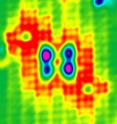 Four atomic quantum dots are coupled to form a "cell" for containing electrons. The cell is filled with just two electrons. Control charges are placed along a diagonal to direct the two electrons to reside at just two of the four quantum dots comprising the cell. This new level of control of electrons points to new computation schemes that require extremely low power to operate. Such a device is expected to require about 1,000 times less power and will be about 1,000 times smaller than today's transistors.