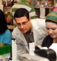 Dr. Alexander Cole works with students in his lab at the University of Central Florida in Orlando