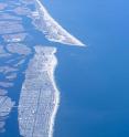 An aerial view of Long Island shows its low-lying shores, vulnerable to sea-level rise effects.