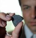 This is University of Chicago postdoctoral scientist Philipp Heck with a sample of the Allende meteorite. The dark portions of the meteorite contain dust grains that formed before the birth of the solar system. The Allenda meteorite is of the same type as the Murchison meteorite, the subject of Heck’s <i>Astrophysical Journal</i> study.