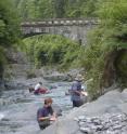 Researchers collect rock samples in South China.