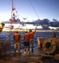 This image shows the deployment of the spar buoy off the stern of the R/V Ka'Imikai-O-Kanaloa.