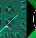 The NIST microhotplate uses its thermal efficiency in conjunction with a thermocouple to form a self-test temperature sensing system. Four microhotplates (left image) are seen with a strip of rhodium film (marked by an arrow) crossing the bottom right microhotplate. This strip makes contact with the platinum in the microhotplate structure (seen in the closeup image on the right) to form a stable thermocouple for measuring temperature