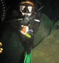 Jessica Keller holds the primate skull found in the Padre Nuestro Cavern.