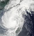 The MODIS instrument on NASA's Aqua satellite captured an image of Tropical Storm Parma in the Luzon Strait, heading into the South China Sea, during the early morning hours of Oct. 5, 2009. Parma was passing the Philippines (south) and Taiwan (north).