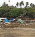 Maximum tsunami run-up exceeded 14 meters at Aufaga on Upolu Island, Samoa. The event produced total destruction, with tsunami trimline in the vegetation and survivors living on top of the rubble.