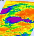 This infrared image from AIRS shows Nida fading top left (in purple and blue) on Dec. 2 at 16:11 UTC (11:11 a.m. ET) and System 97W developing (bottom right). The highest, coldest, thunderstorm cloud tops are in purple (as cold as -63F).
