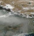 This image shows a blanket of haze is common in the Indo-Gangetic Plain. The haze piles up along the Himalaya Mountains, forming a strip of white-gray that obscures the ground. The Moderate Resolution Imaging Spectroradiometer (MODIS) on NASA's Aqua satellite captured this true-color image on Dec. 2, 2009.