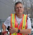 Lead researcher Steven Chillrud models a subway-friendly air sampler.