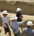 Professor J. Ramon Arrowsmith of Arizona State University (second from left), Professor Lisa Grant Ludwig (pointing) and Dr. Sinan Akciz (black shirt) of University of California, Irvine show  exposures of sediments in the San Andreas fault zone at Bidart Fan to scientific reviewer, Professor Ray Weldon (far right) of University of Oregon while ASU graduate student (far left) watches.