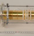 The picture shows the Penning trap, which is part of the Shiptrap experiment. A magnetic field parallel to the tube forces the arriving ions onto a spiral course inside the tube. The ions' spiraling frequency is used to directly calculate their atomic mass. The Penning trap is located inside the white tank that can be seen in picture 1.