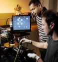 Researchers Raghunath Murali and graduate student Kevin Brenner(front) perform electrical measurements on a graphene sample  under high vacuum in a cryogenic probe station.