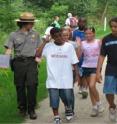 Local middle students students participate in an activity with a ranger in Cuyahoga Valley National Park.