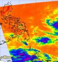 The Atmospheric Infrared Sounder instrument on NASA's Aqua satellite captured an infrared image of Tropical Storm 02W on March 23 at 0453 UTC (12:53 a.m. EDT) far to the east of the Philippines (left). There was still some strong convection (purple) near the storm's center.