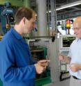 IFAM researchers inspecting components produced using metal injection molding.