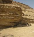 USGS scientists look at Eocene sandstones and limestones in Wadi Degla, northern Egypt. This area was studied to understand the Levant Basin Province, as both regions have similar rock formations.