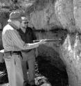 University of Arizona anthropologist C. Vance Haynes and geophysicist Allen West look at the Black Mat Layer during a sampling excursion to the Murray Springs Clovis site in Southern Arizona.