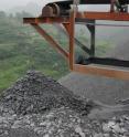 Heaps of ore tailings are exposed directly to the open air at Xikuangshan.