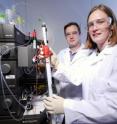 Thomas Barker, an assistant professor in the Wallace H. Coulter Department of Biomedical Engineering at Georgia Tech and Emory University, and postdoctoral fellow Sarah Stabenfeldt purify proteins on an automated fast flow liquid chromatography device.