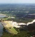 This is an aerial photograph taken near the time of the 2002 flood event at Canyon Lake, Texas. Floodwaters overflowed Canyon Lake reservoir and carved the gorge downstream.