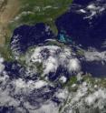 The GOES-13 satellite captured a visible image on June 25 at 10:45 a.m. EDT of System 93L (large area of clouds far left) in the western Caribbean Sea which may become Alex and a second area of cloudiness and showers (far right) east of the Leeward Islands that forecasters are watching for tropical development.