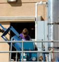 Undergraduate student Chris Moore operates the innovative sludge dryer for the University of Nevada, Reno’s wastewater sludge-to-power research project at the Truckee Meadows Water Reclamation Facility.