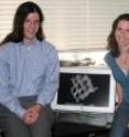 John Moore and Susannah Porter with computer screen displaying a fragment of armor that probably comes from a siphogonuchitid, an enigmatic animal from the earliest Cambrian period.