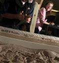 Vanderbilt sedimentologist David Furbish, left, and undergraduate Grace Loy are using a stream table to study the currents that are causing Locke Island -- a small island in the Columbia River in eastern Washington that has special cultural significance to local Indian tribes -- to erode at an alarming rate.