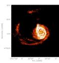 The distribution of HI hydrogen in the Whirlpool Galaxy (M51) as determined by the THINGS VLA survey extends far beyond the visible stars in the galaxy and its satellite companion (marked by cross), which is situated in the short arm of the spiral. Analysis of perturbations in the hydrogen distribution can be used to predict the location of such satellites, in particular, those satellites that are composed primarily of dark matter and are thus too faint to be detected easily.