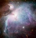 This new image of the Orion Nebula was captured using the Wide Field Imager camera on the MPG/ESO 2.2-meter telescope at the La Silla Observatory, Chile. This image is a composite of several exposures taken through a total of five different filters. Light that passed through a red filter, as well as light from a filter that shows the glowing hydrogen gas, is colored red. Light in the yellow–green part of the spectrum is colored green, blue light is colored blue and light that passed through an ultraviolet filter has been colored purple. The exposure times were about 52 minutes through each filter.