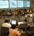Federal emergency managers work with their state counterparts in Louisiana during a mock hurricane exercise. EMCAPS software helps emergency managers estimate casualty numbers when they are planning training exercises.