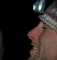 University of Calgary biologist Brandon Klug holds a silver-haired bat (<I>Lasionycteris noctivagans</I>) captured during a night out in southern Alberta.