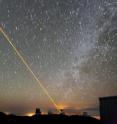 A WUSTL scientist has invented the biomedical equivalent of the astronomers' guide star.To correct for atmospheric blurring, astronomers sometimes shine a laser into the sky near the spot where a telescope is pointing. The laser beam energizes sodium atoms naturally present above the stratosphere, producing a glowing artificial star called a guide star. The astronomers use the ‘twinkling’ of this guide star to continuously compensate for the effects of atmospheric turbulence on the light they are collecting from nearby stars. The guide star thus allows astronomers to obtain much sharper, more detailed images free of atmospheric blurring. Shown here is a laser beam projected into the night sky from the Keck-2 telescope on Mauna Kea, Hawaii.