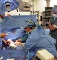 Dr. Kodi Azari (left) and members of his surgical team perform the first hand transplant in the western United States at Ronald Reagan UCLA Medical Center in Los Angeles, March 5, 2011.