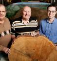 William McClain (left), a botanist with the Illinois State Museum; with botanist John Ebinger and ecologist Greg Spyreas of the Illinois Natural History Survey at the University of Illinois, looked to tree scars for physical evidence of fires over a period of 226 years in southern Illinois.