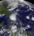 The GOES-13 satellite saw Hurricane Irene moving through the Bahamas on Aug. 25, 2011 at 1402 UTC (10:02 a.m. EDT) and far to the east was newly born Tropical Depression 10 (far left). Irene dwarfs Tropical Depression 10, and Irene is about 1/3 the size of the entire US East coast.