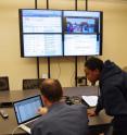 Georgia Tech associate professor Michael Bell (Interactive Computing) and his team monitor social media during the elections in Liberia on Oct. 11, 2011.