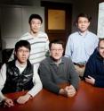 Illinois researchers developed spiral polypeptides that can deliver DNA segments to cells with high efficiency and relatively low toxicity, a step toward clinical gene therapy. The team, from left, postdoctoral researchers Lichen Yin and Dong Li; Fei Wang, a professor of cell and developmental biology; Jianjun Cheng, a professor of materials science and engineering; and Nathan Gabrielson, a postdoctoral researcher.