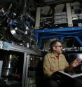 Sandia combustion researchers Craig Taatjes and David Osborn discuss data found from the detection and measurement of Criegee intermediate reactions. The apparatus seen on the left was used to make the measurements, which researchers believe will substantially impact existing atmospheric chemistry mechanisms.