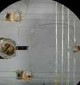 This microscope image shows thermometers (top and bottom) and a heater (right) connected via 50-micrometer-wide gold wires to a black rectangle of the ytterbium dirhodium disilicide (center) that is only three-quarters of a millimeter wide. Using this setup, researchers at the Max Planck Institute for Chemical Physics of Solids in Dresden, Germany, induced a thermal current by setting up a small difference in temperature at the two ends of the sample. The proportionality coefficient between this temperature difference and the thermal power provided by the heater defined the thermal conductivity of the sample, which was found to violate traditional laws of physics when the material was cooled to a "quantum critical point."