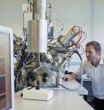 Professor Morgan Alexander studies samples with the Time of Flight Ion Mass Spectrometry.