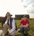 Left to right shows Roger Pierson, Gregg Adams and Karin van Straaten with a few of the University of Saskatchewan llamas east of Saskatoon, Saskatchewan, Canada.