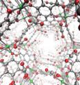 Open-metal site MOFs are crystalline molecular systems that can serve as storage vessels with a sponge-like capacity for capturing and containing carbon dioxide and other flue gases before they enter the atmosphere.