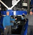 Matt Dubberley, Lead Engineer, (left) and David Sand, Lead Astronomer stand beside Faulkes Telescope North and the new FLOYDS spectrograph.