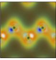 Simulated valence-charge density from x-ray and optical wave-mixing shows the nuclei of carbon atoms as dark spots revealed by diffracted x-rays and the peaks of some of the bonds between them as white and blue spots induced by the polarized optical pulse. In diamond, the optical pulse primarily wiggles the charge that makes up chemical bonds.