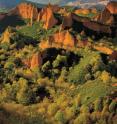 Hydraulic gold mining by Romans nearly 2,000 years ago left this dramatic example of human modification of the landscape at Las Médulas, Spain, a UNESCO World Heritage Site. Water obtained from surrounding mountainous watersheds was used to undermine the >100-m-thick Miocene alluvial fan sediments here until they collapsed -- a process called ruina montium, loosely translated as ruin the mountain -- and then washed to separate the gold. Tailings total ~90 Mm3. Photo by Justino Diez.