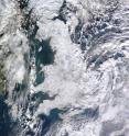 The satellite image shows widespread snowfall in the UK in December 2010. Other areas in Europe experienced relatively warm and wet conditions at this time, despite a weak inflow of air coming from the Atlantic (negative North Atlantic Oscillation). Credit NASA / Jeff Schmaltz.